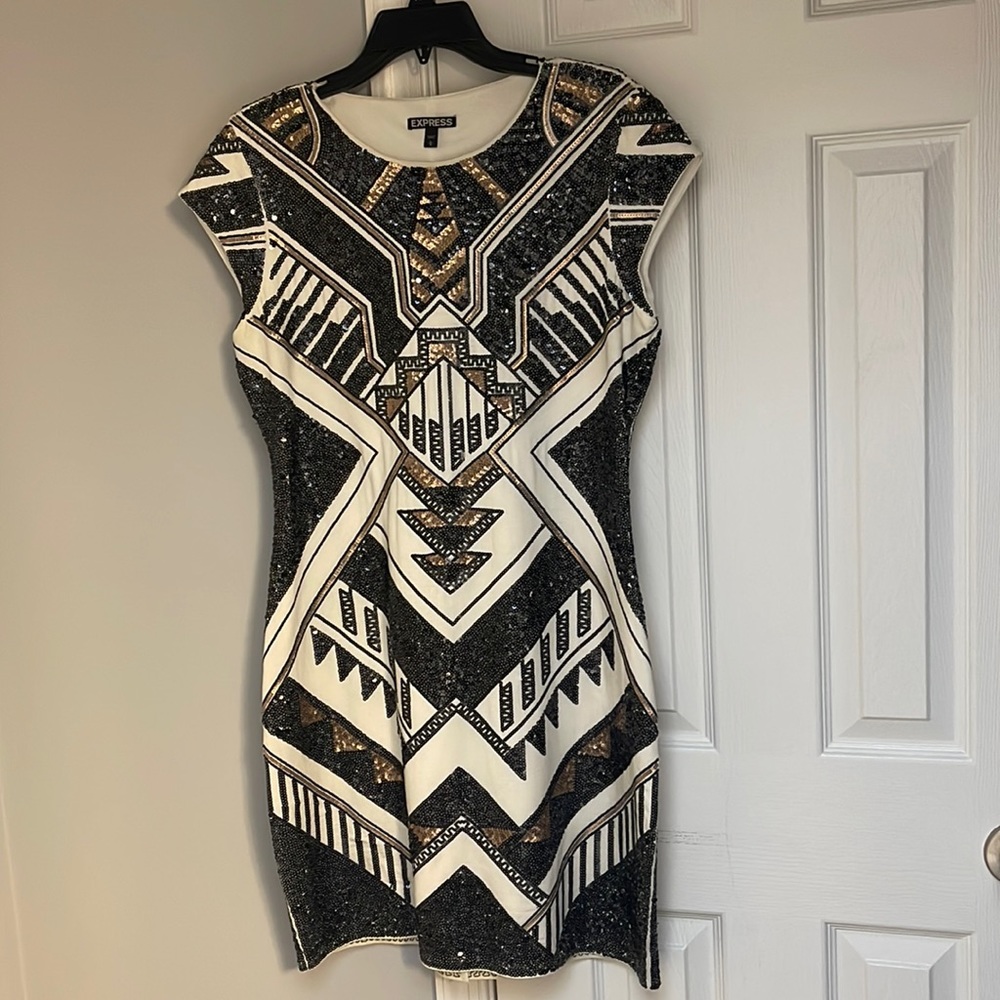 Black and gold sequins dress.